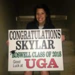 high school senior Skylar with graduation sign