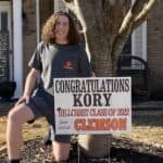 High School Senior Kory With Graduation Sign