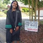 High School Senior Toni Marie With Graduation Sign